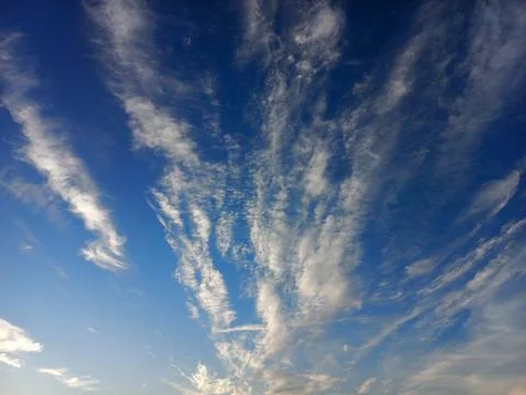 Feather clouds at blue sky Stock Photos