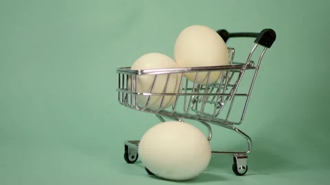 Feather falling on eggs in shopping cart. Stock-Footage 151029119