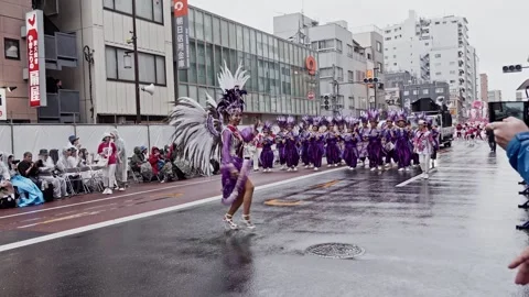 Feather Fan Dancer Spinning Beside a Straw Hat Wearing Walker Stock Footage 346189326