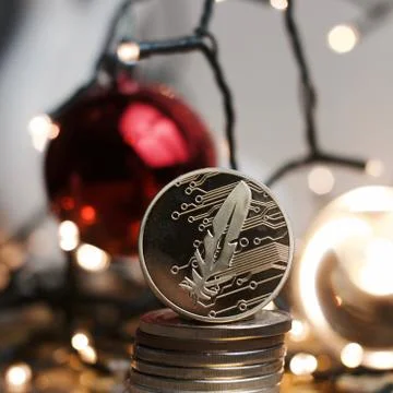 Feather gold coin Stock Photos