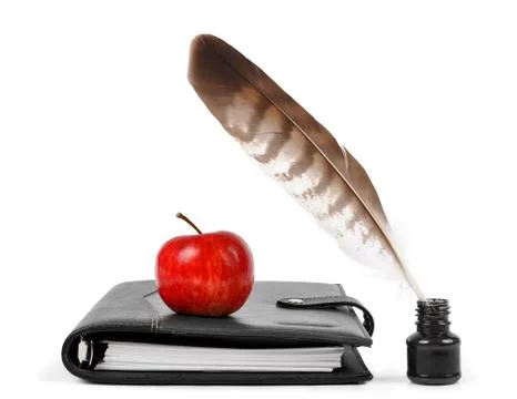Feather in ink bottle Stock Photos