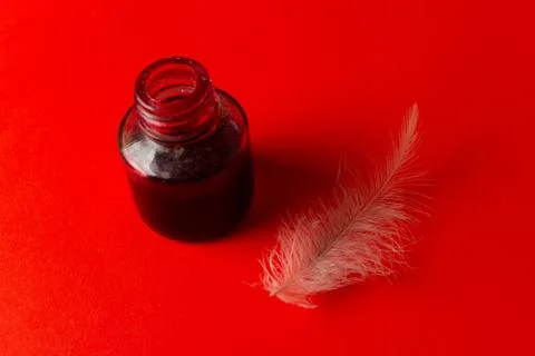 Feather with red ink Stock Photos