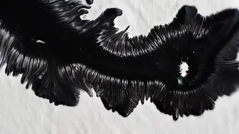 Feathered ink bloom forms intricate circular patterns on white background Stock Footage 308731127