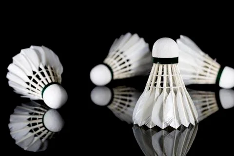 Feathered White Shuttlecocks on Black Stock Photos