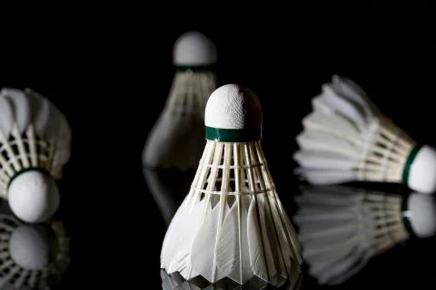 Feathered White Shuttlecocks on Black Stock Photos