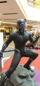Features a life size statue of the Marvel superhero Black Panther Stock Photos