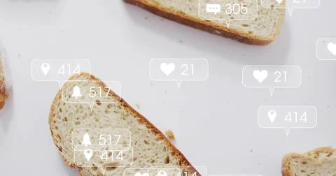 Featuring angled slice of seeded bread sitting on white surface, with crumbs and Stock Photos