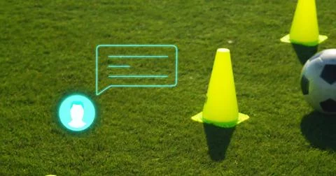 Featuring bright yellow training cone standing on turf with turquoise digital Stock Photos