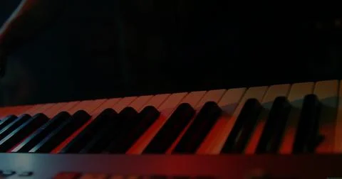 Featuring electronic keyboard reflecting colored stage lights in music studio, Stock Illustration