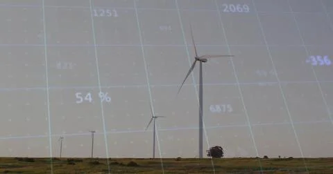 Featuring large wind turbine rising against overlaid data grid on rural plain, Stock Photos