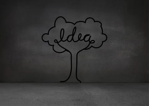 Featuring stylized tree doodle spelling 'Idea' on concrete wall above floor Fotos Stock