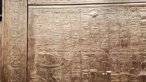 Feb12, 2026, Cairo, Egypt: hieroglyphs, golden sarcophagus of  Egyptian pharaoh Stock Footage 345845654