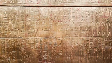 Feb12, 2026, Cairo, Egypt: hieroglyphs, golden sarcophagus of  Egyptian pharaoh Stock Footage 345846014