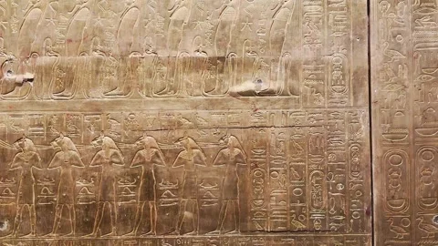 Feb12, 2026, Cairo, Egypt: hieroglyphs, golden sarcophagus of Egyptian pharaoh. Stock Footage 345846127