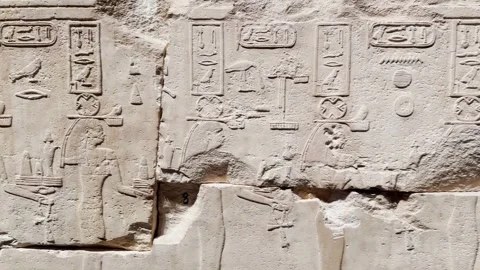 Feb12, 2026, Cairo, Egypt: a wall with ancient Egyptian hieroglyphs Stock Footage 345844077