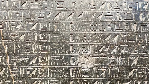 Feb12, 2026, Cairo, Egypt: a wall with ancient Egyptian hieroglyphs Stock Footage 345846220