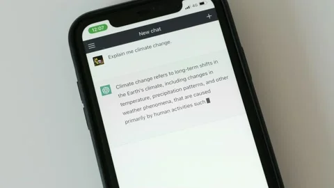 FEBRUARY 14, 2023: ChatGPT iPhone Screen Close-up of an Example of Chat a Person Stock Footage 233095756