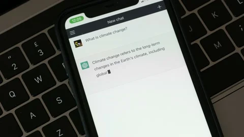 FEBRUARY 14, 2023: ChatGPT iPhone Screen Close-up of an Example of Chat a Person Stock Footage 233096435
