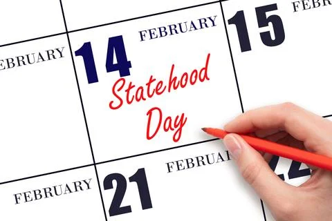 February 14. Hand writing text Statehood Day on calendar date. Save the date. Stock Photos