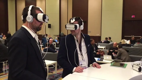 February 2, 2016 - Washington D.C.: Two businessmen try out virtual reality usin Stock Footage 70176446