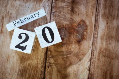 February 20th. Day 20 of February month, white calendar blocks on vintage woo Stock Photos