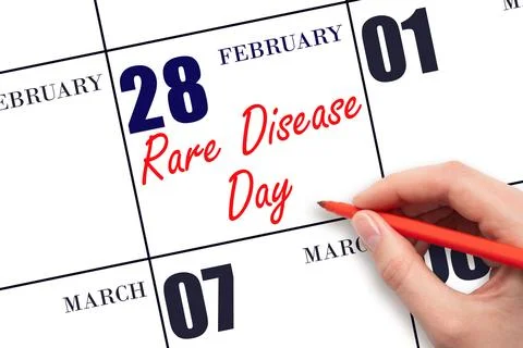 February 28. Hand writing text Rare Disease Day on calendar date. Save the da Stock Photos