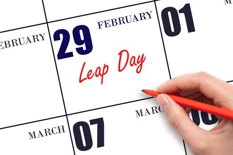 February 29. Hand writing text Leap Day on calendar date. Save the date. Stock Photos