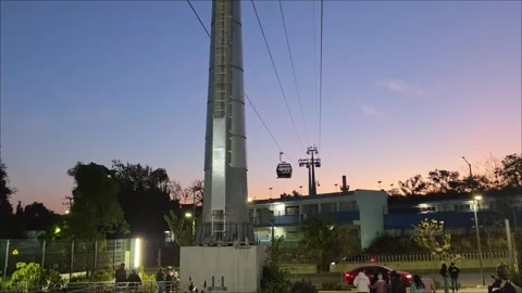 February 7, 2026, Arrival of cable car cabins during sunset in Mexico City Stock Footage 333266844
