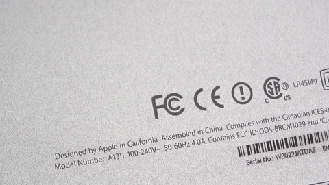 Federal Communications Commission logotype on computer back rear part Stock Footage 107783777