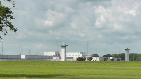 Federal Correctional Complex Wide Shot with Towers Stock Footage 147953983