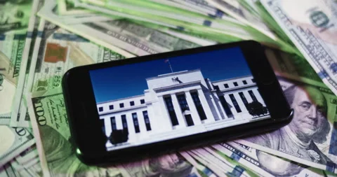 The Federal reserve Image on iphone surrounded by $100 Bills. Stock Footage 169007355