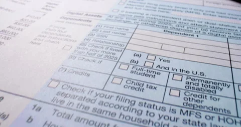 Federal tax return forms with red pen. Video stock 345722978
