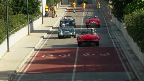 Federico Heitz 1968 Jaguar E Type #73 leading group of classic sports cars from Video stock 324934811