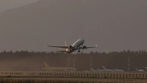 FedEx airplane takes off at sunset Stock Footage 158665438