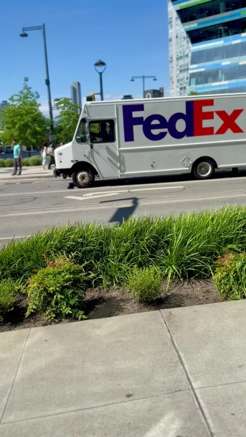 FedEx Delivery Truck Turning At Intersection In Surrey⁠ Stock Footage 336111741