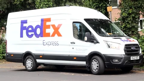 Fedex Express van parked with indicators flashing Video stock 277362380