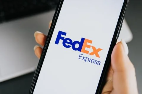FedEx logo on smartphone screen. 写真素材