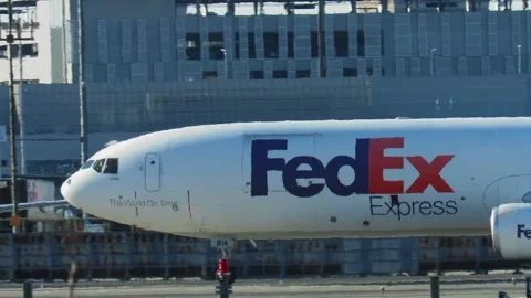 FEDEX McDonnell Douglas MD-10 cargo plane taxis at Newark Airport Stock Footage 232902625