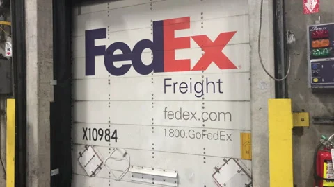 Fedex Trailer backed in to loading dock at distribution facility Stock Footage 264116535