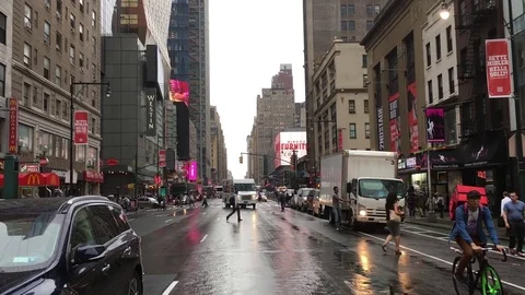 Fedex Truck approaching intersection in NYC traffic Stock Footage