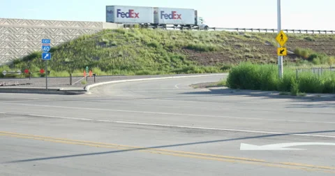 Fedex Truck on Interstate 40 with I-40 East Road Sign Stock Footage 60640442