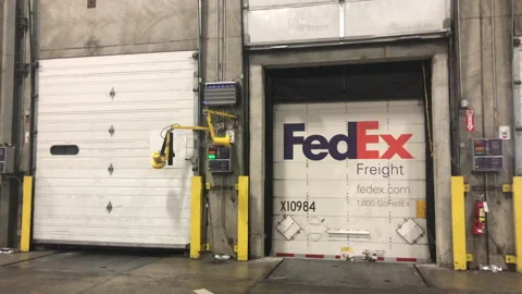Fedex Truck logo on back parked in Distribution warehouse Stock Footage 264116771