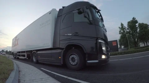 FedEx Trucks passing Stock Footage 83626200