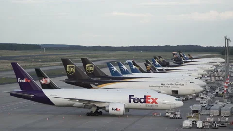 FedEx, UPS, Star Air Cargo / Freight Airplanes on Airport Apron, Tarmac, Cologne Video stock 190633192