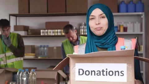 Feed The Fasting: Donate Iftar Packs In Ramadan. Muslim Volunteers Packing Stock Footage 322727032