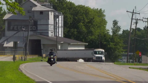 Feed Truck pulls out of Feed Company Stock Footage 147947472