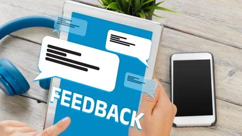 Feedback on digital device with messages and smartphone in modern workspace Stock Photos
