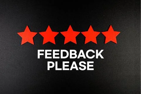 Feedback Please text with five star on black background Stock Photos