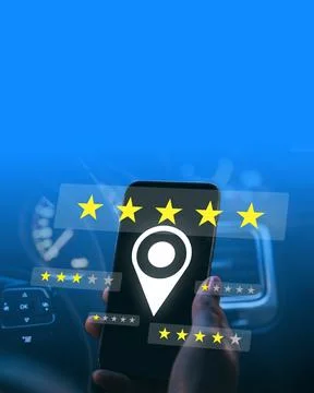 Feedback rating displayed on a smartphone inside a car at night with a clear Stock Photos