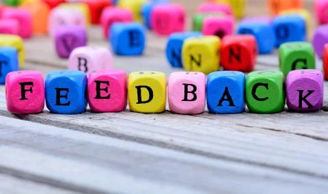 Feedback word on table Stock Photos